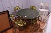 Set of one 36x36x28 inch round vinyl top card table, one 33x33x28 inch round vinyl top card table, and three matching floral vinyl folding chairs in a room with wooden floor and white closet doors.