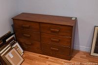 Front view of maple finish dresser with six drawers, showing general condition and arrangement.