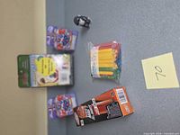 Top-down view showing all five boxed or bagged items on table