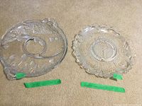 Both glass platters side by side on carpet