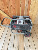 Full view of Benchmark 4,650W generator on wooden deck
