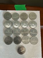 Front view of all 17 1985 Canadian Voyageur $1 coins