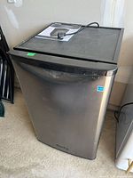 Front and side view of Danby compact refrigerator