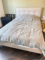 Full view of assembled Endy double bed with bedding