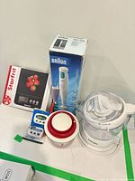 All items grouped: boxed scale, boxed hand blender, juicer, chopper, timers