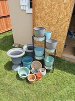 Group shot of all planters, stand and garden stone