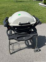 Front view of Weber portable barbecue on rolling stand
