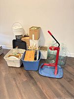 Group shot of carboys, corker, buckets, totes and boxed bottles