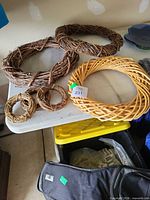 Group of six wreath forms on table showing size range and materials