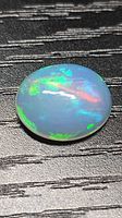 Top view of opal displaying multicolour flashes