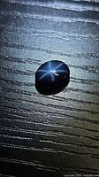 Front view of blue star sapphire showing six-ray star asterism