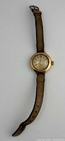 Full view of watch with strap showing overall design and wear
