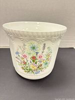 Front view showing Wild Tudor floral design and rim decoration