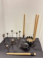 overview of both candle holders and four gold tapers