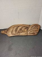 Full view of carved eagle head plaque