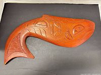 Full view of cedar fish-shaped plaque