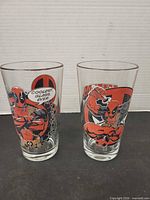 Both Deadpool pint glasses front view