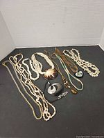 All eight necklaces laid out together