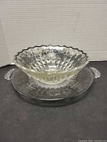 Bowl nested inside handled plate showing overall design