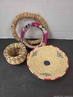 Group shot of four coiled straw items