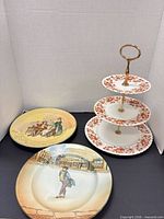 Overall view of cake stand and two decorative plates