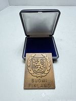 plaque in front of open presentation case