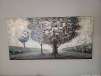Full view of horizontal acrylic landscape painting with three abstract trees