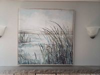 Frontal view of entire framed canvas landscape art above mantel