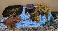 Overview showing tray, metal stand, faux florals and ceramic figurines