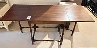 Table fully extended showing top surface and leg structure