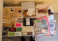 Full lot overview showing wood stamps, ink pads, clear stamp sets, acrylic blocks, tin, spray bottles