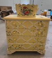 Front view of dresser with planter on top