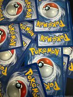 Spread of card backs displaying standard Pokémon design