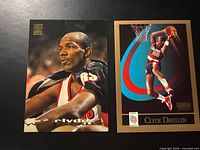 Fronts of both Clyde Drexler cards: Topps Stadium Club #17 portrait and SkyBox #233 dunk image