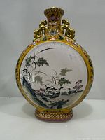 Front view of yellow ground moon flask showing crane and bamboo scene