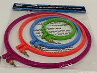 Front view of sealed package showing all four colorful embroidery hoops