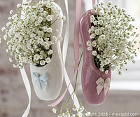 Front view of both ceramic ballet slippers showing bows and ribbon attachments