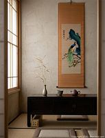 Scroll displayed hanging on wall in room setting