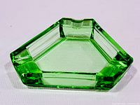 Top view of lime green geometric glass ashtray