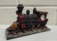 Left-front view showing locomotive details and candle cavity