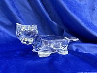 Side view of clear glass cat-shaped dish