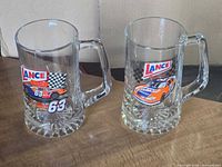 Front view of both glass beer mugs showing Lance Snacks NASCAR graphics
