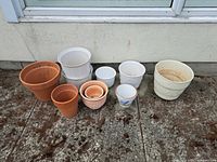 Full group of ten assorted pots lined up outside