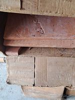 Open box showing terracotta ceramic tiles