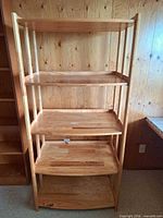 Full view of four-tier wood shelving unit