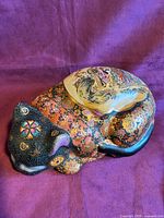 Full view of hand painted Satsuma sleeping cat figurine