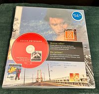 Front of sealed Collection Canada 2005 album showing Oscar Peterson CD, bonus offer, price $54.95