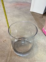 Side view of clear cylindrical glass jar showing height and shape