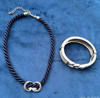 Necklace and bracelet full view on blue background