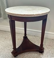 Full view of round fossil marble top table
